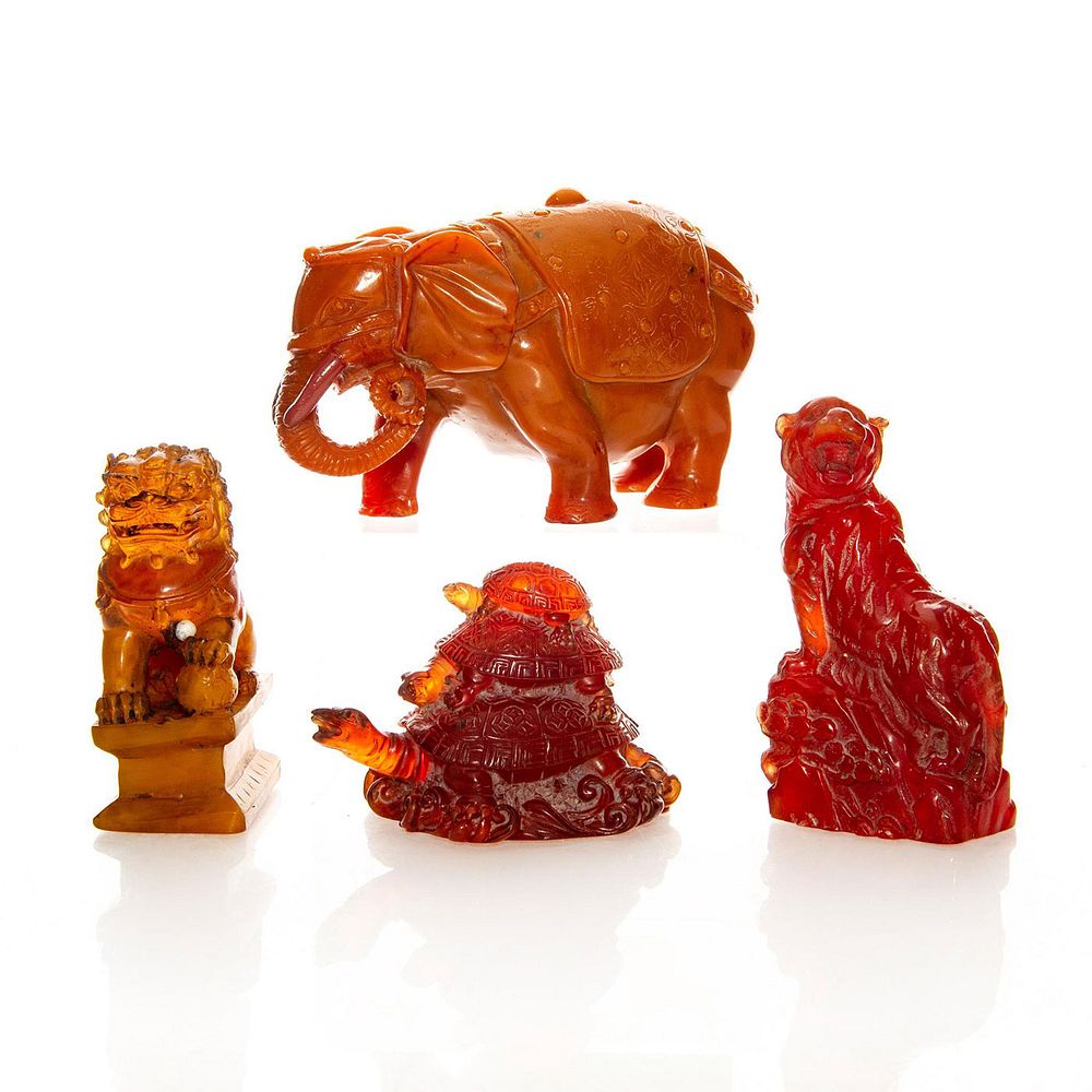 Appraisal: CHERRY AMBER ASIAN ANIMAL FIGURES Tiger Elephant Chinese Lion and