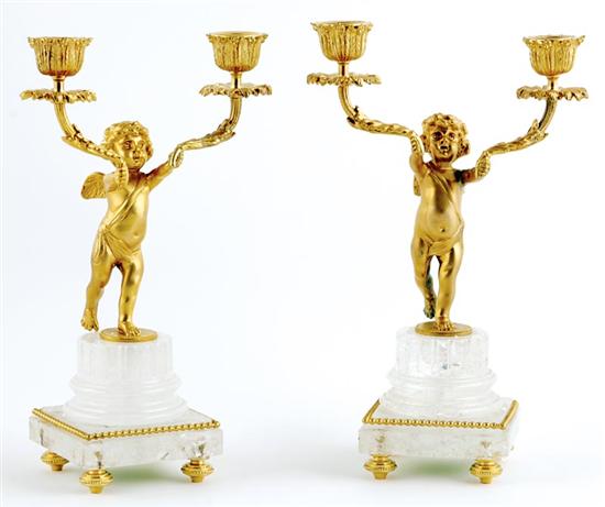 Appraisal: Unusual pair of gilt-metal and rock-crystal candelabra standing cherubs supporting