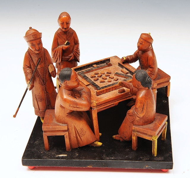 Appraisal: A GROUP OF CHINESE BOXWOOD FIGURES seated at a table