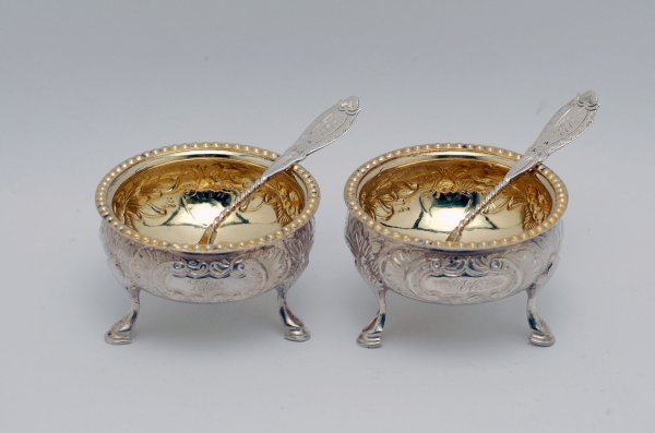 Appraisal: Two coin silver footed salt cellars Reposse with gold wash