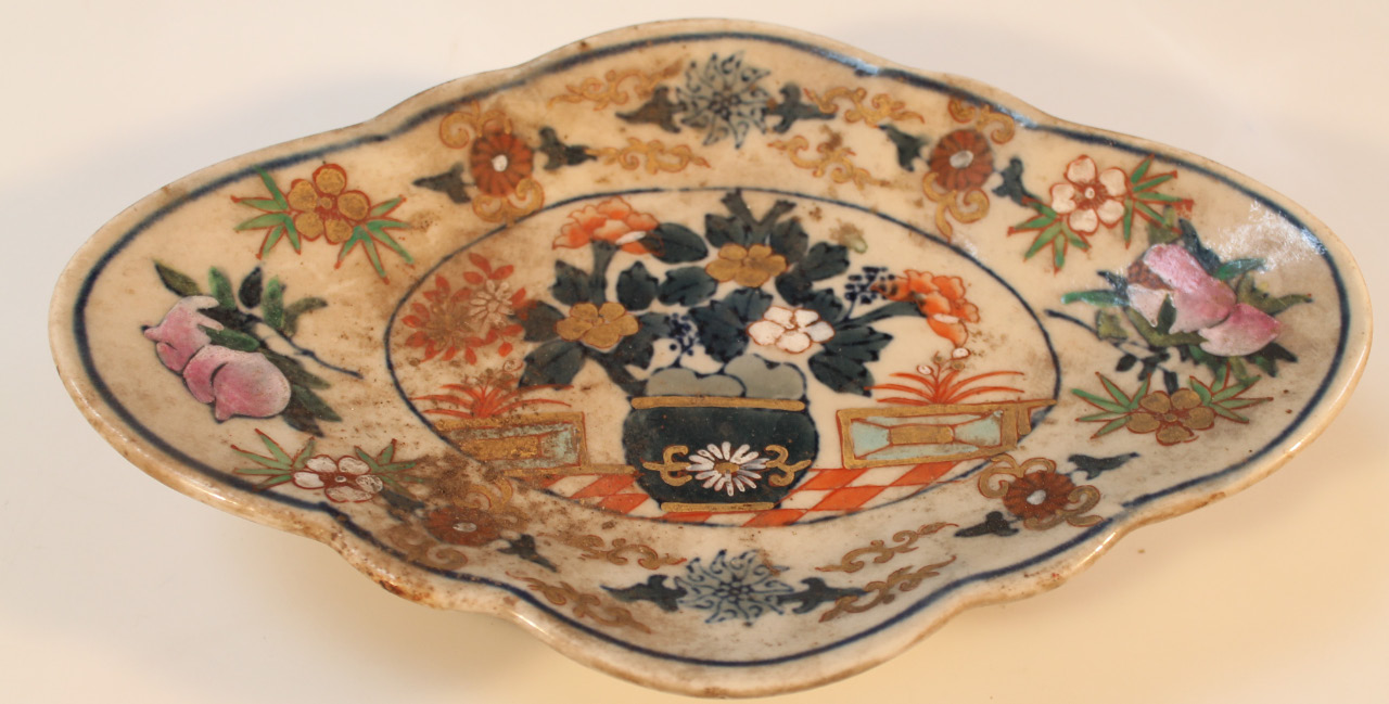 Appraisal: A Chinese earthenware dish the shaped outline polychrome decorated with