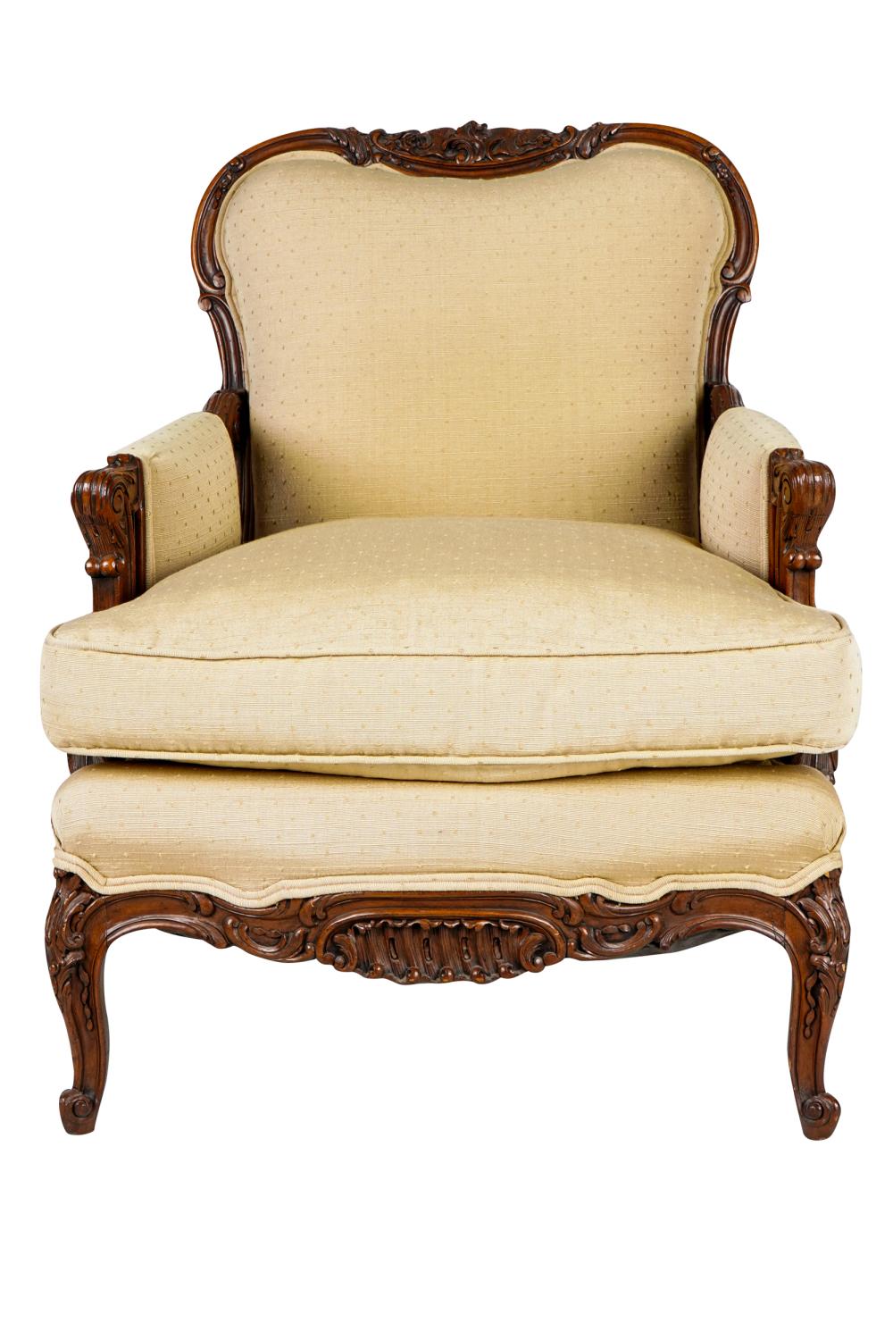 Appraisal: ROCOCO-STYLE CARVED WOOD BERGEREcovered with beige fabric Condition fabric clean