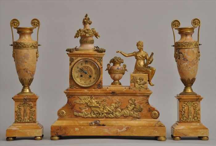 Appraisal: EMPIRE-STYLE GILT-METAL MOUNTED SIENNA MARBLE MANTEL CLOCK GARNITURE Retailed by