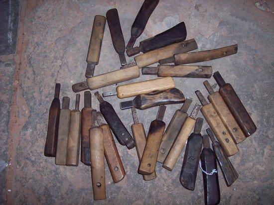 Appraisal: A large quantity of wooden handled edge irons various