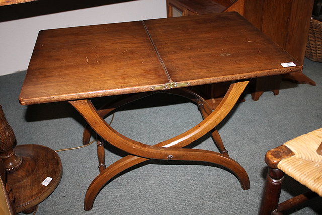 Appraisal: A MAHOGANY SMALL COACHING TABLE with folding top cm when