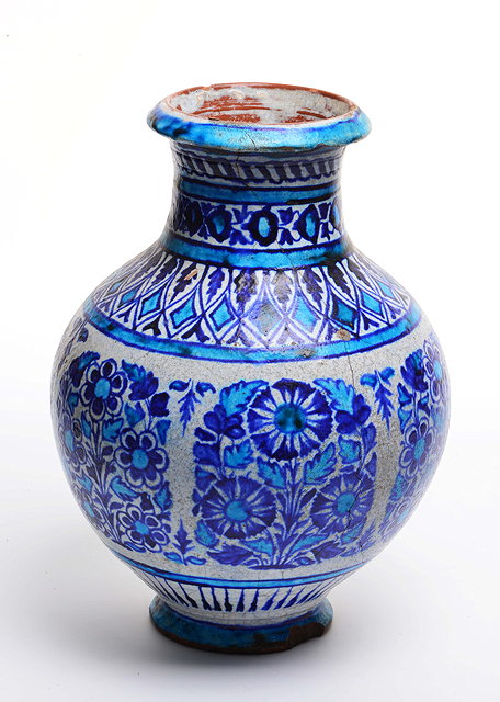 Appraisal: AN ISNIC AND POSSIBLY TURKISH BLUE AND WHITE GLAZED TERRACOTTA