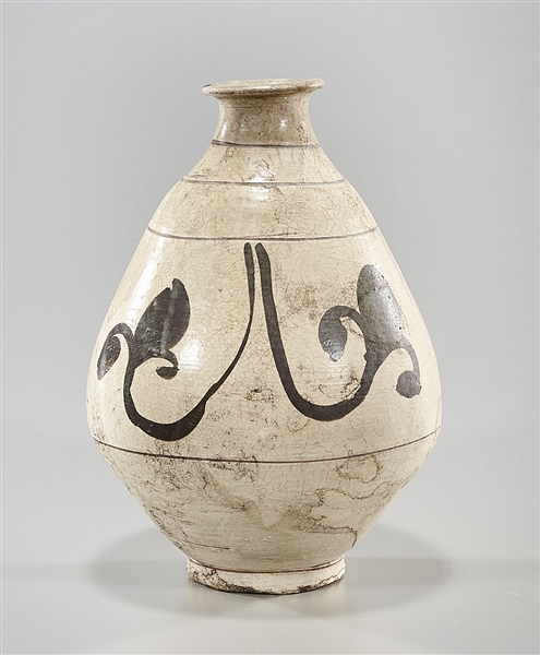 Appraisal: Korean incised and glazed ceramic vase with foliate design x