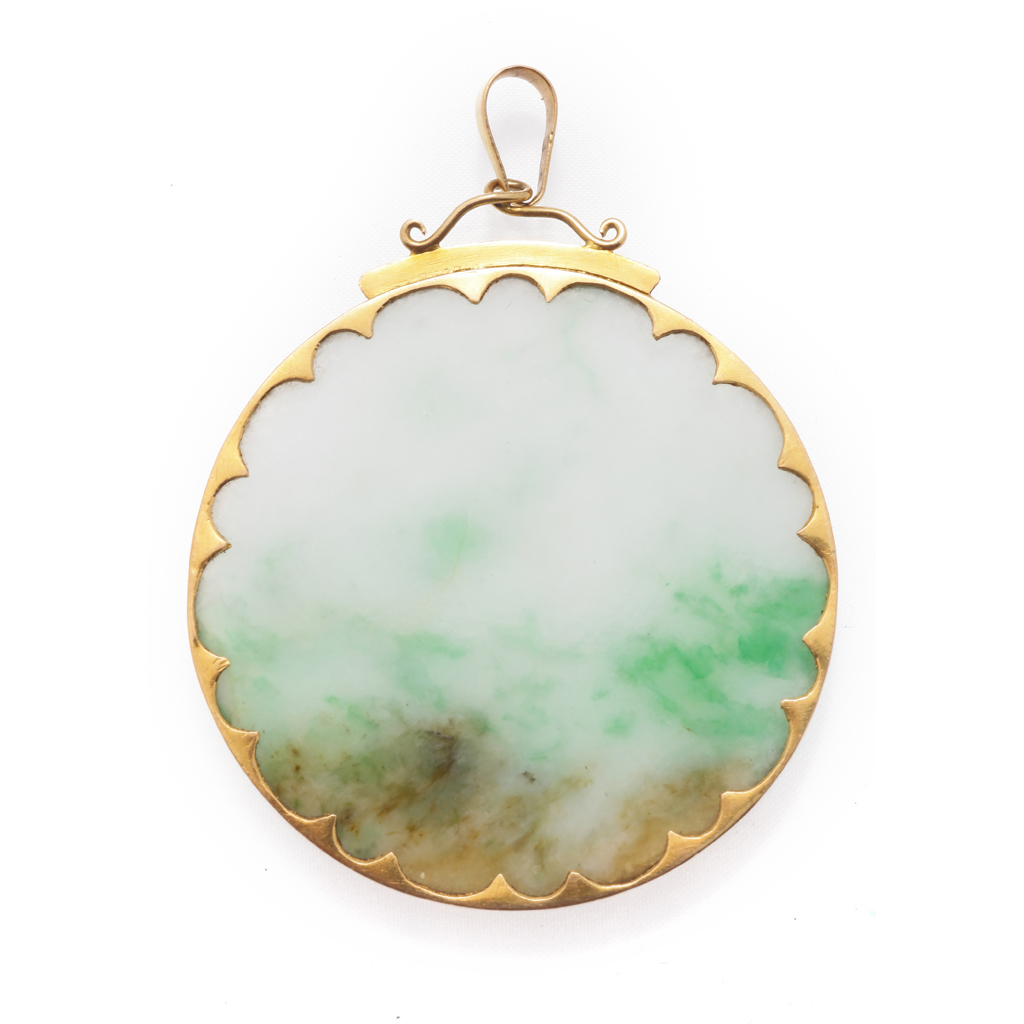 Appraisal: A jade set pendant composed of a circular jade disc