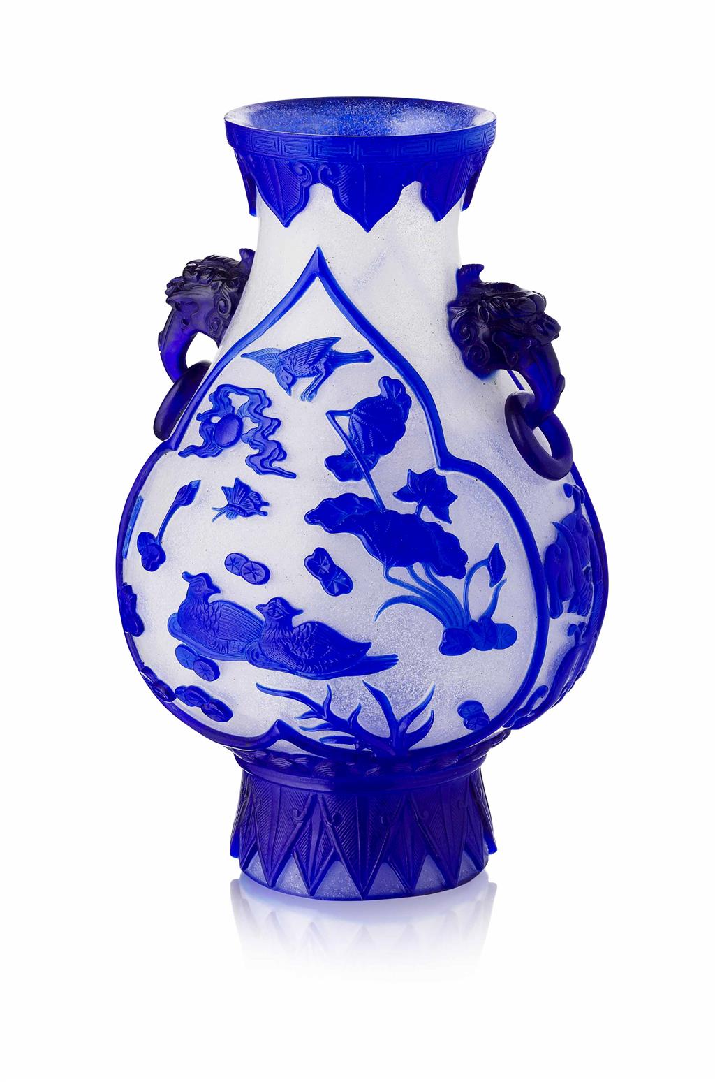 Appraisal: BLUE OVERLAY PEKING GLASS VASE QING DYNASTY the pear-shaped body