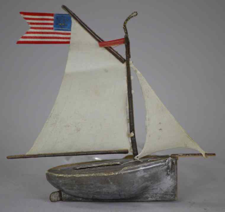 Appraisal: DRESDEN SAILBOAT ORNAMENT Germany silver sailboat with white cloth sails