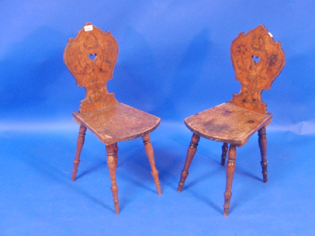 Appraisal: A pair pine and beech poker work child's chairs