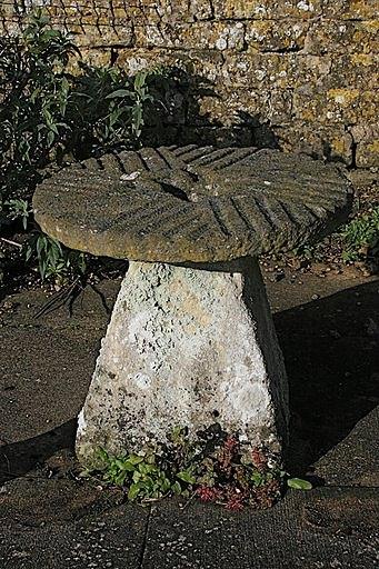 Appraisal: A circular reconstituted mill stone and a square tapered staddle