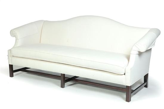 Appraisal: CHIPPENDALE-STYLE SOFA American late th century mahogany Camelback sofa with