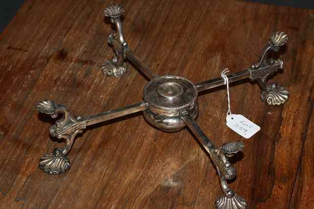 Appraisal: A SILVER PLATED DISH CROSS with shell feet and handles