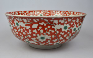 Appraisal: Japanese polychrome bowl decorated with pine trees on a coral