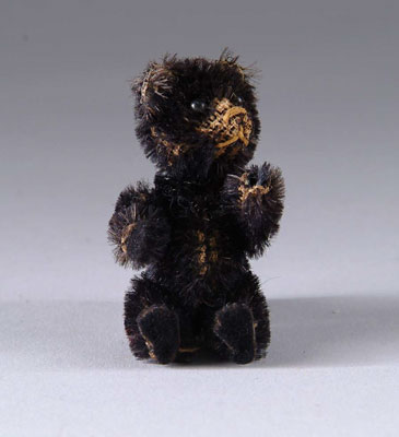 Appraisal: MINIATURE JOINTED TEDDY BEAR Probably Schuco Scarce fully jointed black