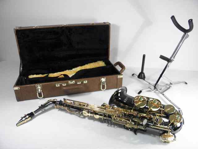 Appraisal: Brass Rumore Alto saxophone In original leather case Includes neck