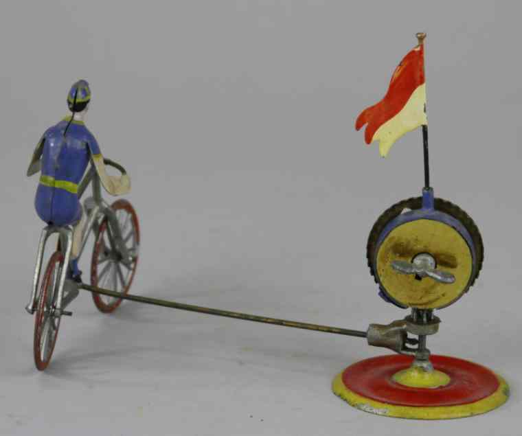 Appraisal: BICYCLE-GO-ROUND TOY Possibly French hand painted depicts man on bicycle