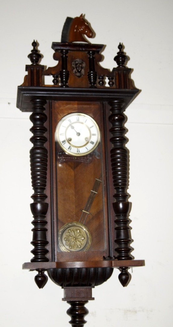 Appraisal: A late thC Black Forest walnut wall clock with day