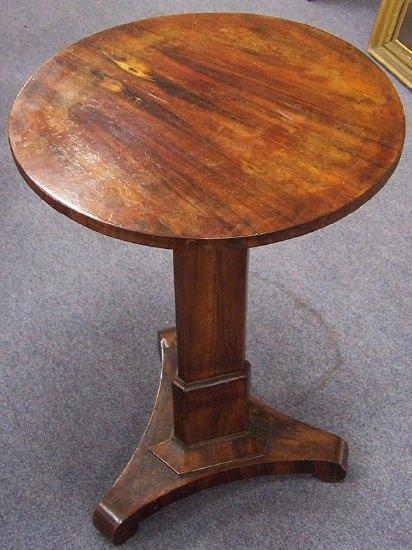 Appraisal: A late Regency rosewood table on a tapered triangular column