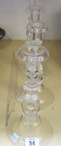 Appraisal: Four Steuben glass candlesticks of turned form with tear-drop inclusion