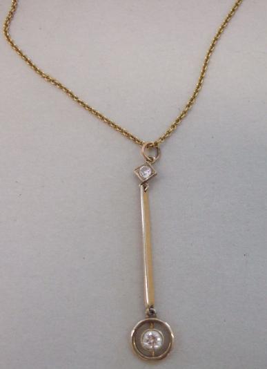 Appraisal: A gold and diamond set pendant necklace collet set with