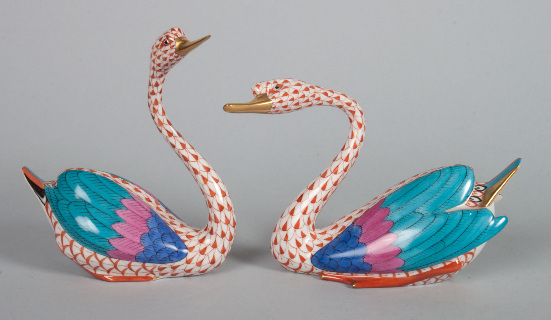 Appraisal: Pair of Herend porcelain swans in the Rust Fishnet pattern