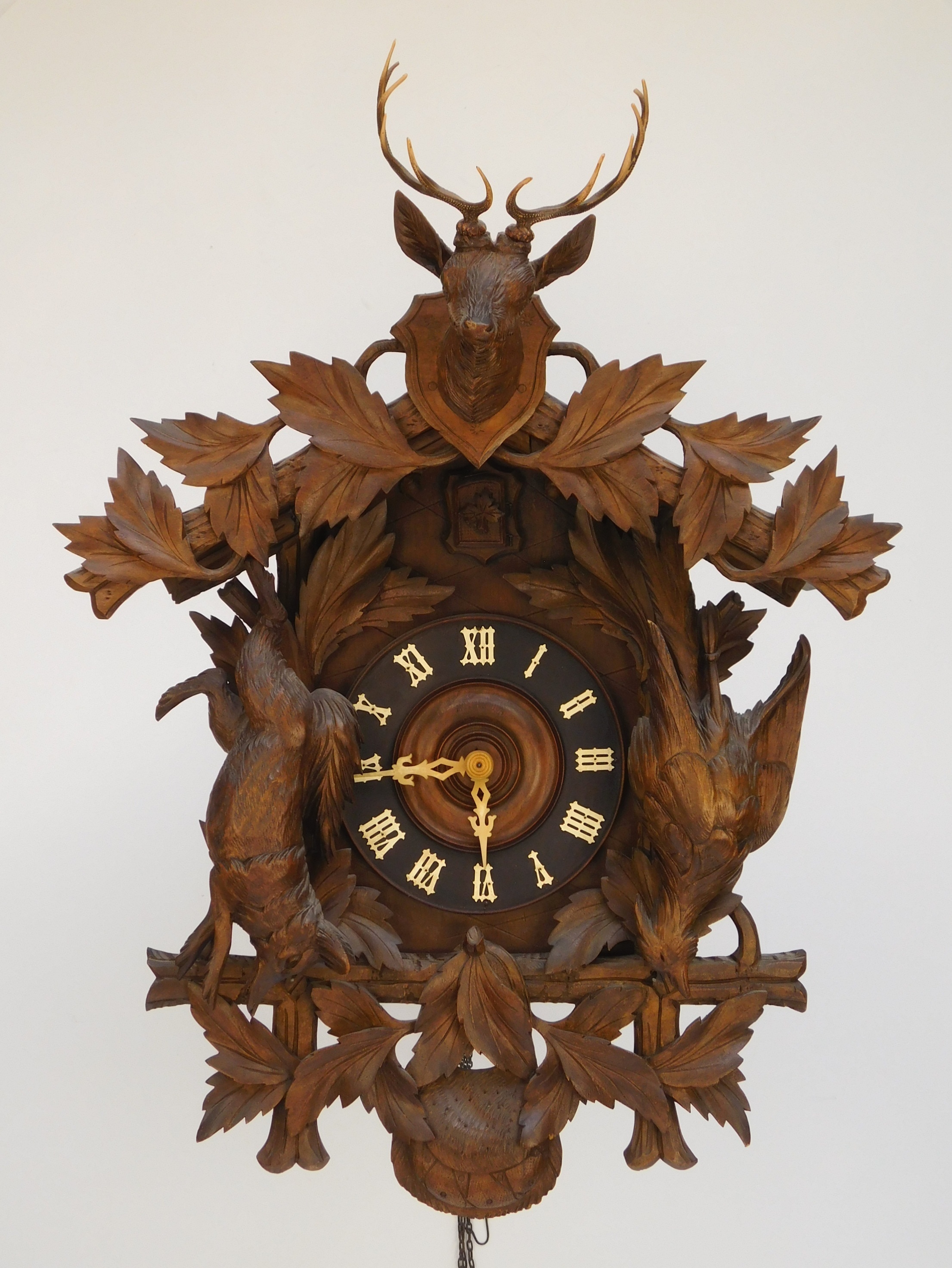 Appraisal: Black Forest carved wooden cuckoo clock marked ''Made in Germany''