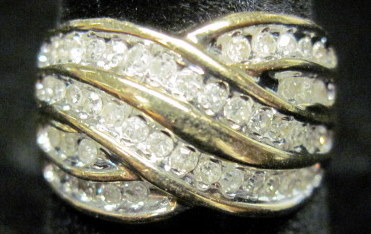 Appraisal: karat yellow gold and diamond ringCriss-cross design set with petite