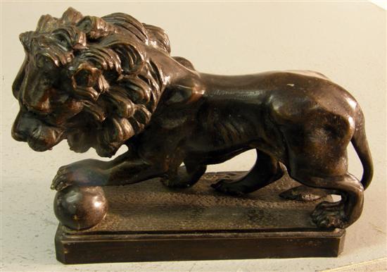 Appraisal: Twentieth century bronze lion one paw raised on a ball