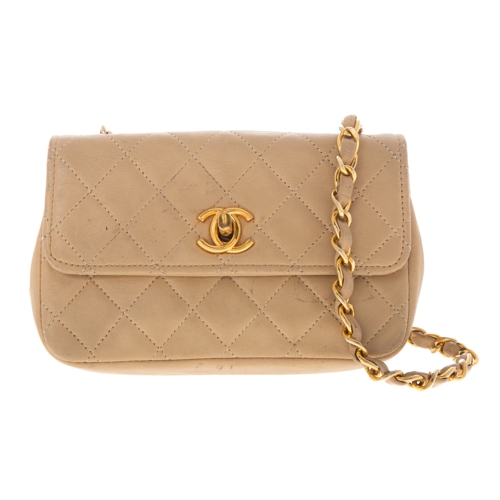 Appraisal: A CHANEL MINI QUILTED FLAP BAG A beige quilted lambskin