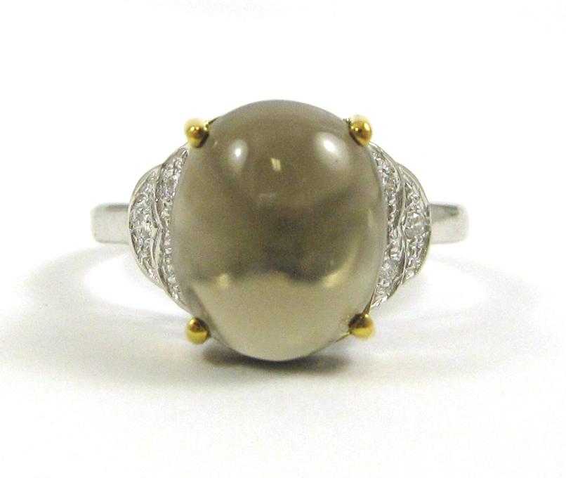 Appraisal: SMOKY QUARTZ AND FOURTEEN KARAT GOLD RING The white and