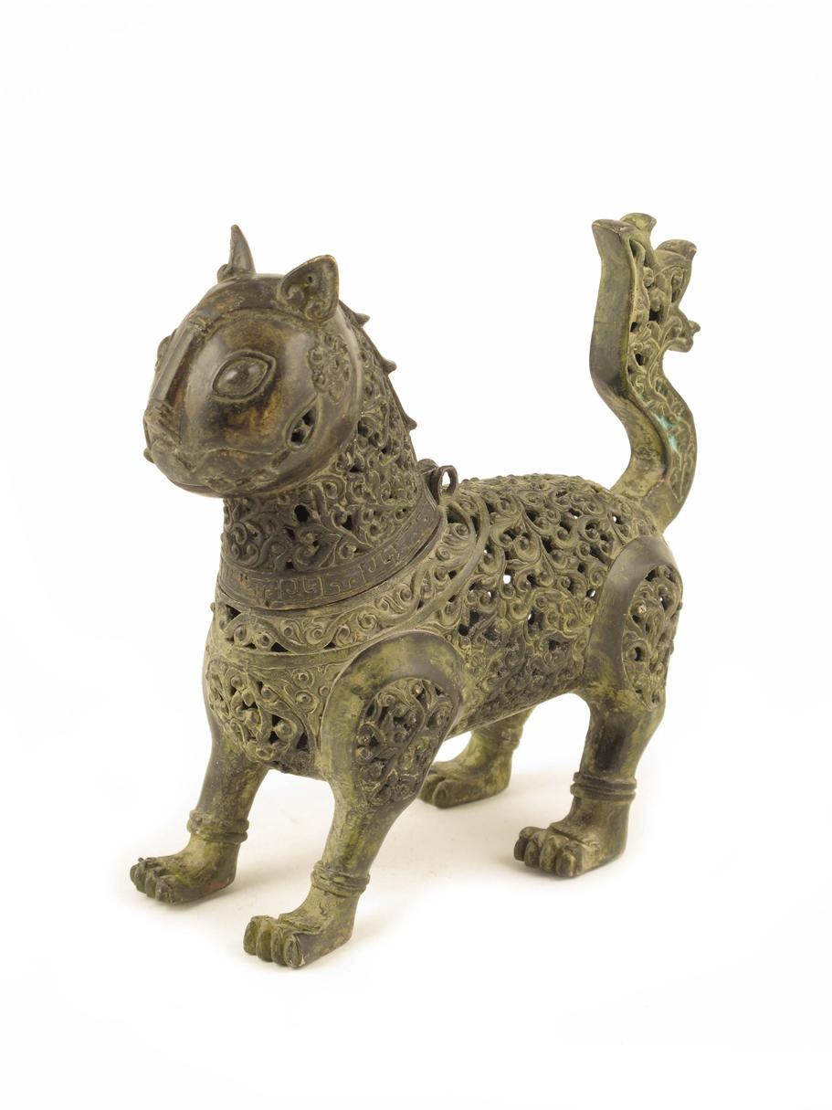 Appraisal: An Islamic bronze incense burner in the form of a