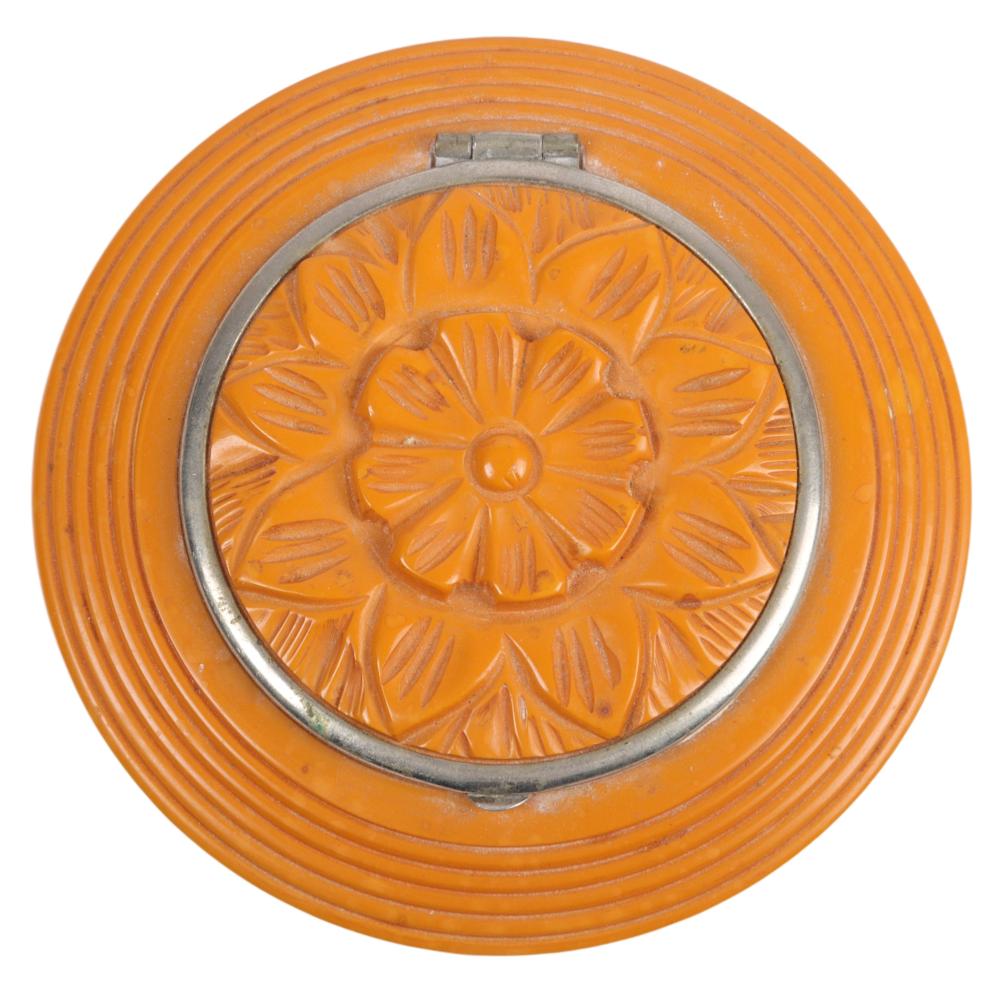 Appraisal: CARVED BUTTERSCOTCH BAKELITE COMPACT DIACarved butterscotch Bakelite compact Circular design