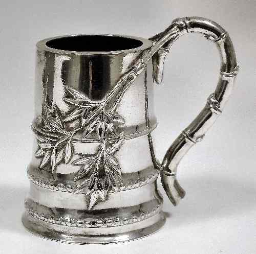 Appraisal: A Chinese silvery metal bamboo pattern tankard cast in relief