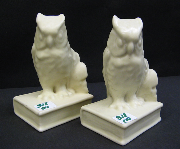 Appraisal: PAIR ROOKWOOD FIGURAL OWL BOOKENDS pale yellow on attached books