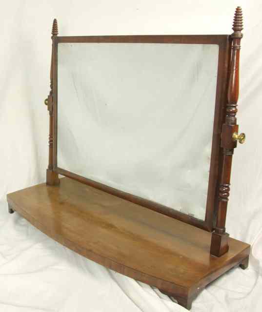 Appraisal: A th Century mahogany swing frame toilet mirror with turned