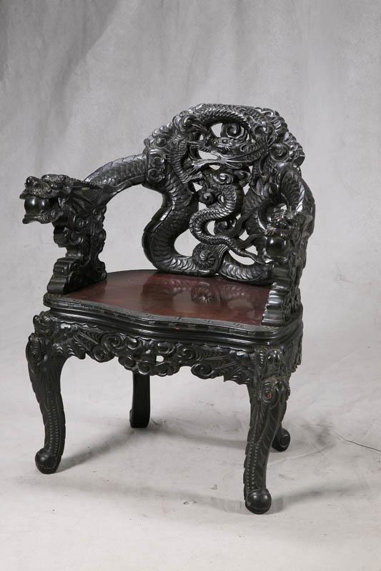 Appraisal: CARVED ARMCHAIR Teakwood oriental style chair with two carved dragon