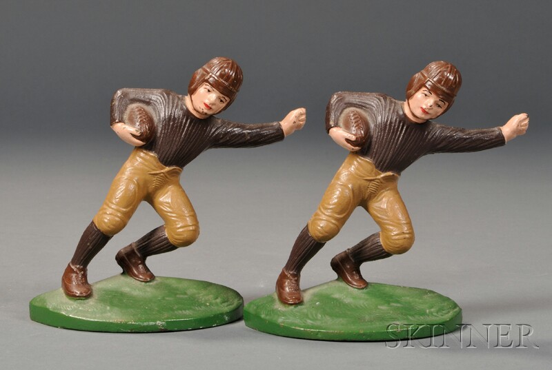 Appraisal: Pair of Cast Iron Football Player Bookends John Wright Company