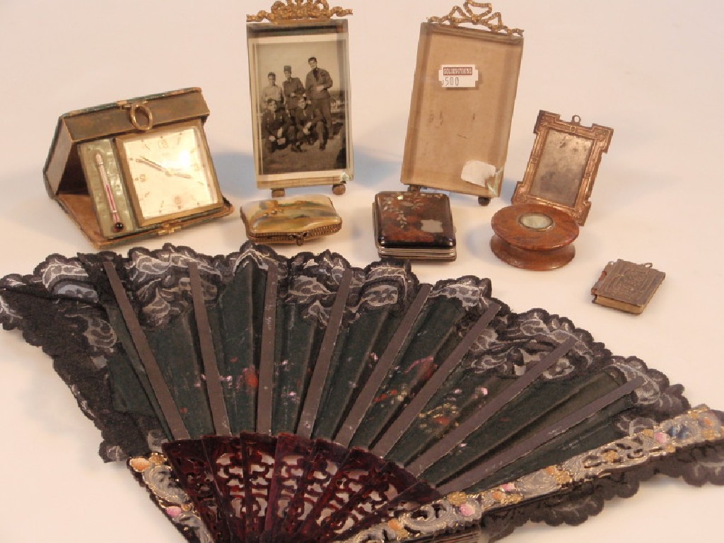 Appraisal: Two bevelled glass photograph frames with gilt cresting on bun