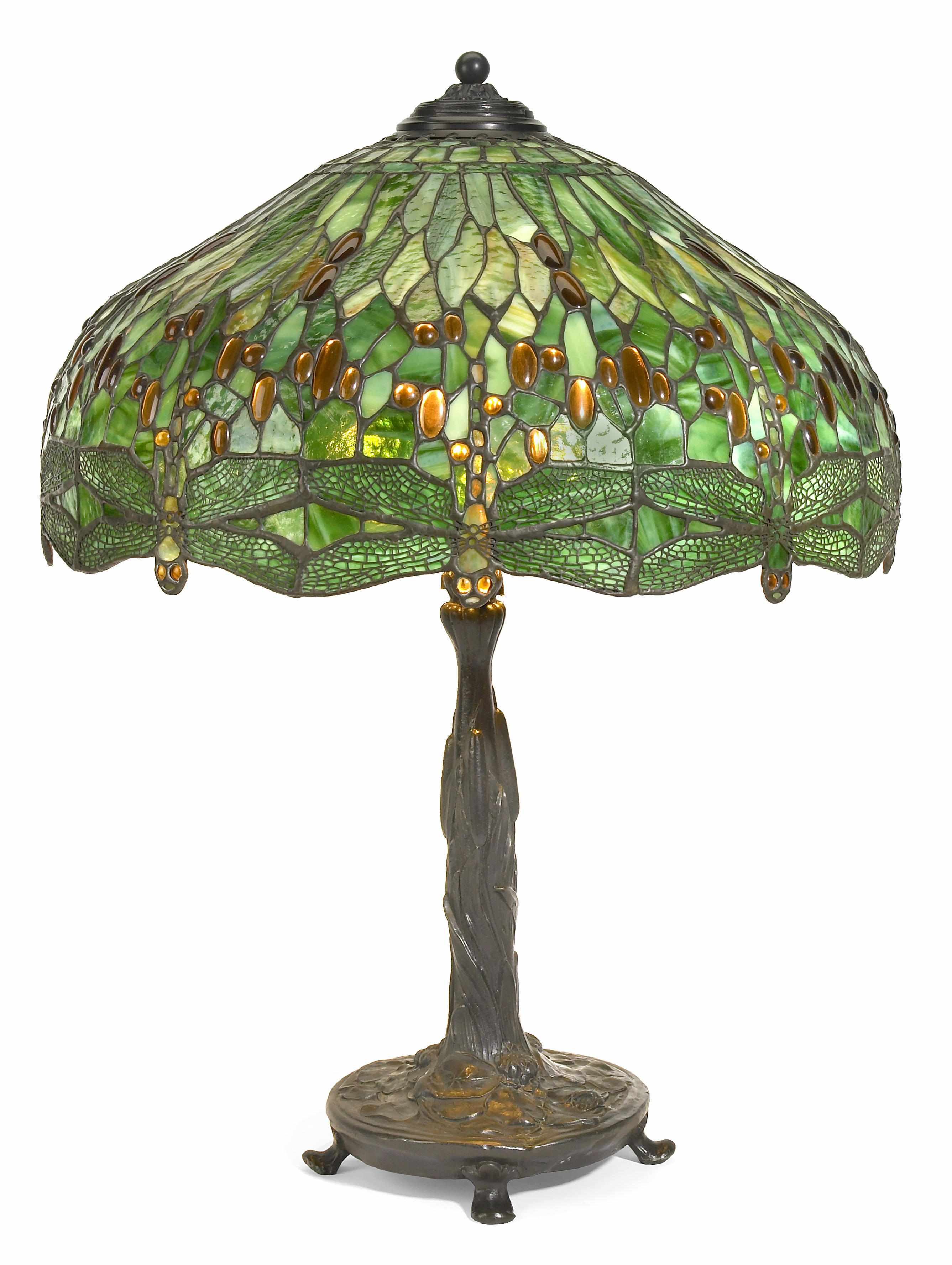 Appraisal: A leaded glass and patinated bronze table lamp height in