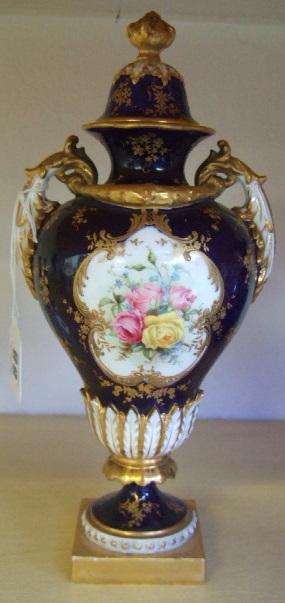 Appraisal: A Royal Worcester two handled lidded vase on cobalt blue