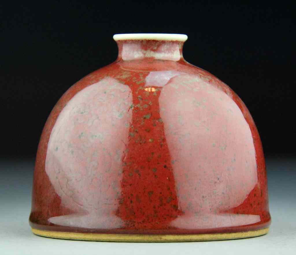 Appraisal: Chinese Strawberry Glaze Porcelain Water potFinely molded water pot in