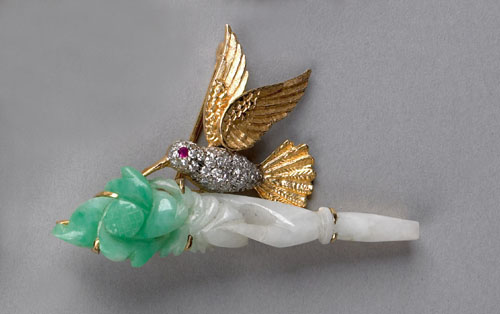 Appraisal: Jade diamond and ruby hummingbird form K yellow gold brooch