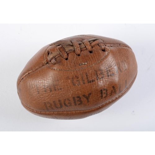 Appraisal: Sport A miniature stitched leather Gilbert rugby ball early th