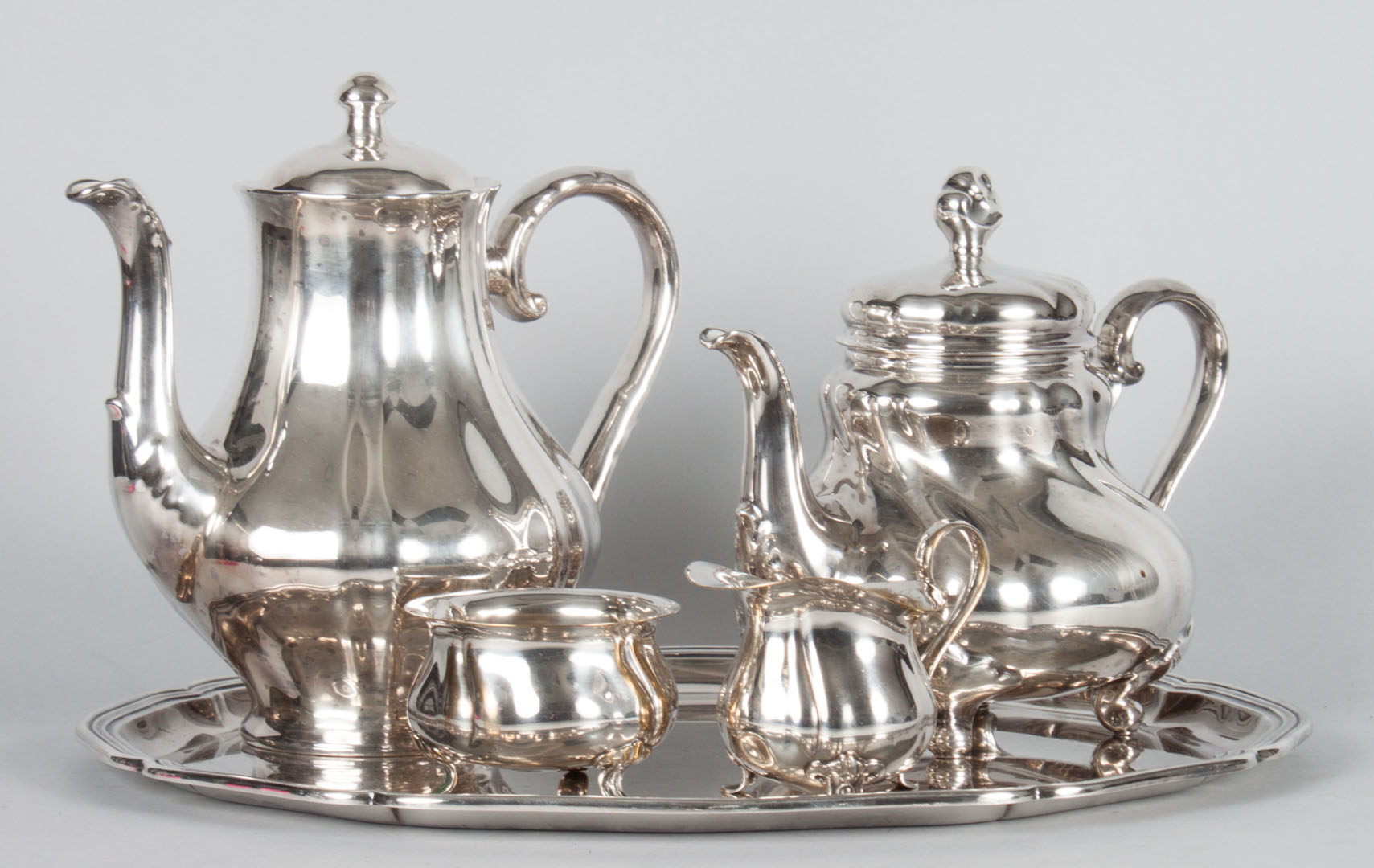 Appraisal: Hutschenreuther silver cased teapot coffee pot together with a German