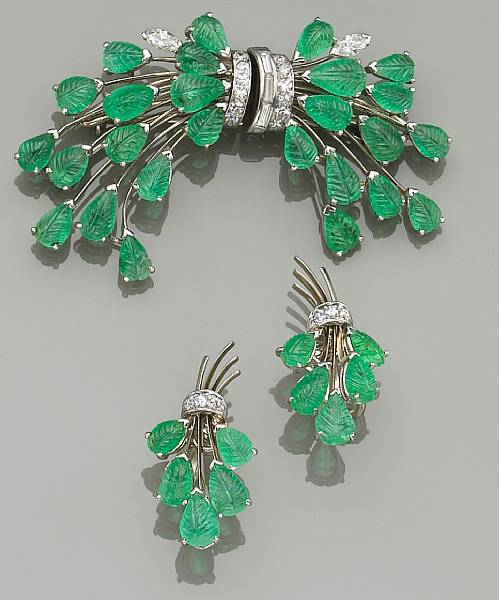 Appraisal: comprising a clip brooch of foliage spray design set with