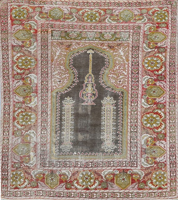 Appraisal: AN OLD TURKISH PANDERMA PRAYER RUG the central lantern within