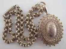 Appraisal: A white metal tests silver Victorian locket with engraved decoration