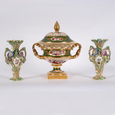 Appraisal: A pair of two-handled vases encrusted with flowers cm high